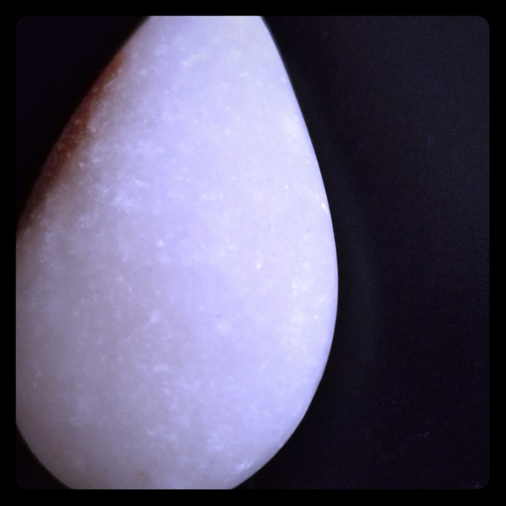 SOLD.  Hand carved raw white jade teardrop pendant